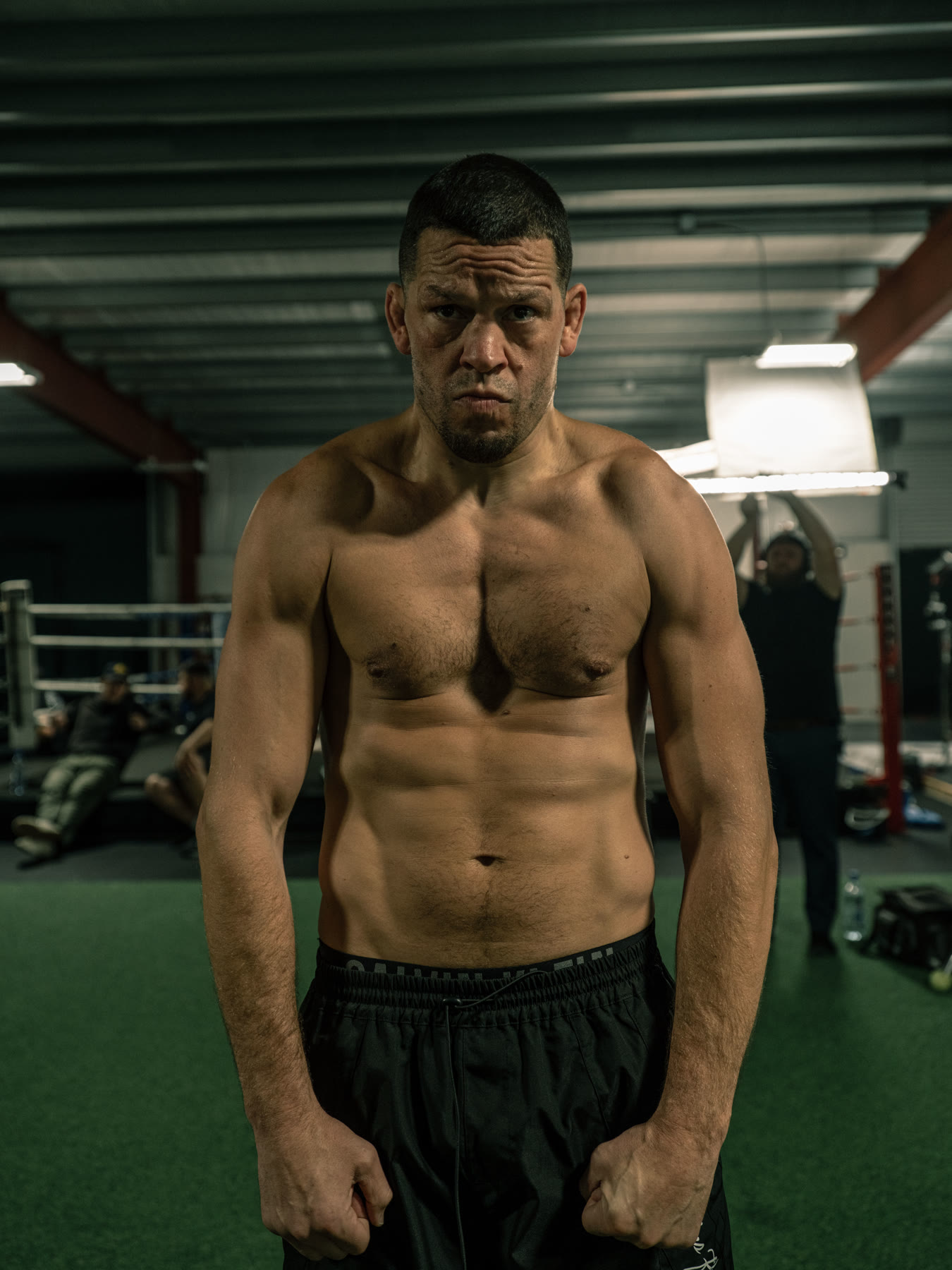 Portrait of Nate Diaz squared to the camera in the gym
